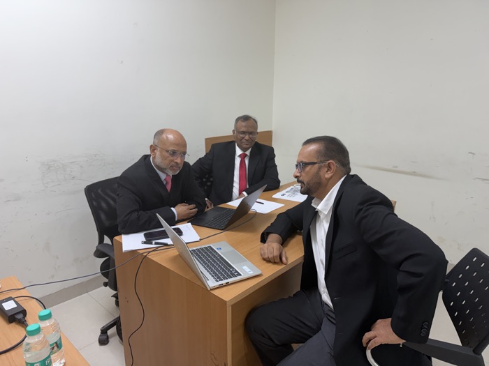 ABTS examiners reviewing a candidate during the oral assessment